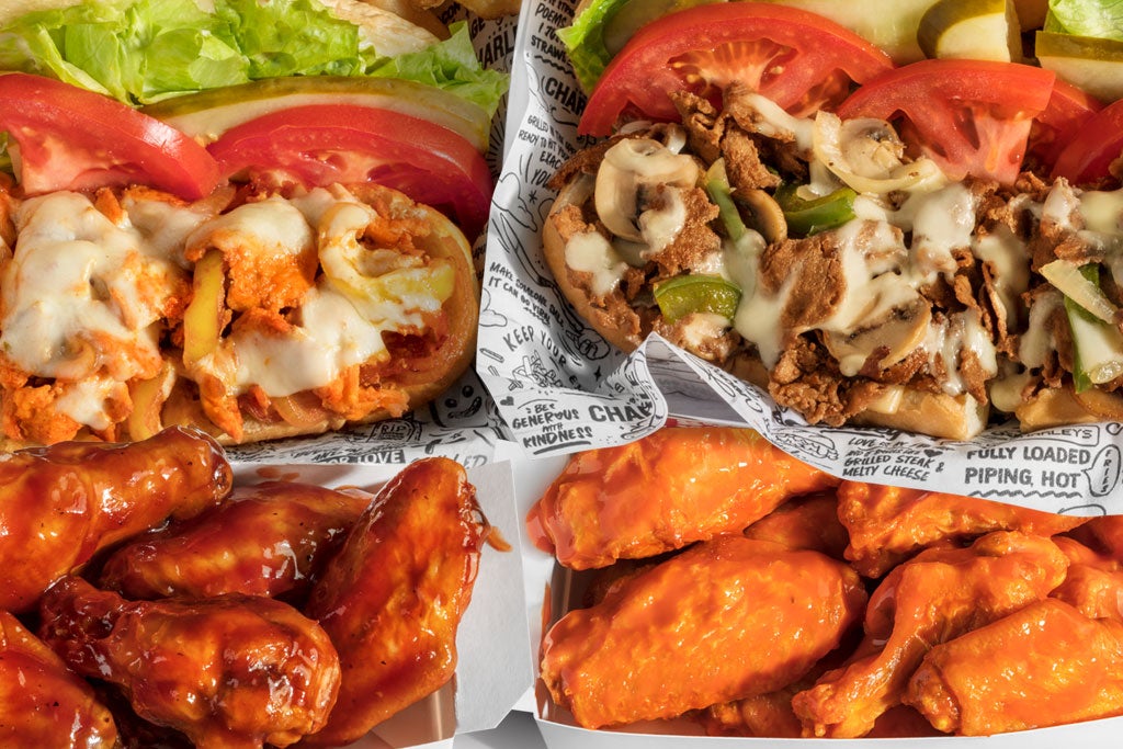 Charleys catering with cheesesteak sandwiches and chicken wings